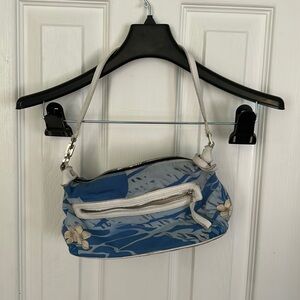 Blue and white Salvatore Ferragamo purse with flowers